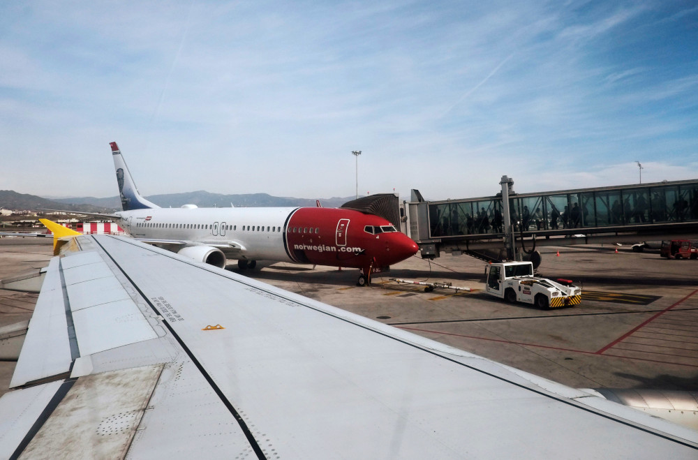 Passengers walk towards a Norwegian aircraft next to a Vueling aircraft before taking off from Malaga-Costa del Sol airport in Malaga, southern Spain February 10, 2019. u00e2u20acu201d Reuters pic